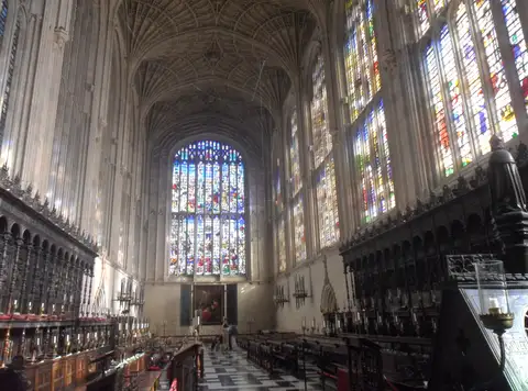 Interior of King's College Chapel with its fan vault, carved stalls and the great east window